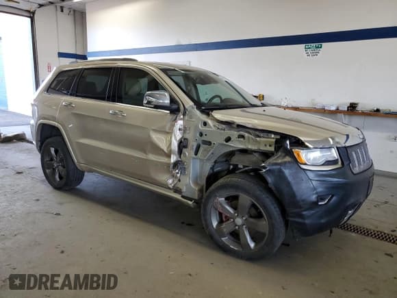 ✅ 2015 Jeep Grand Cherokee Overland • VIN: 1C4RJFCG7FC673181 • Lot: 46527875. Listed on Copart with 124,503 mi. Free auction sales archive from the USA and detailed vehicle history report at DreamBid. Image 4.