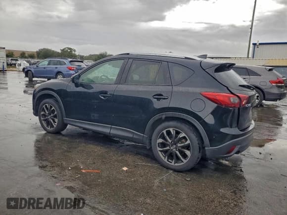✅ 2016 Mazda CX-5 Grand Touring • VIN: JM3KE2DY6G0700984 • Lot: 95326875. Listed on Copart with 244,245 mi. Free auction sales archive from the USA and detailed vehicle history report at DreamBid. Image 2.