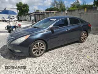 2013 Hyundai Sonata SE with VIN 5NPEC4AB8DH748170, listed as a Copart auction lot 87446305 with 136,156 mi miles and Salvage title. Bid and sale history available at DreamBid. Image 1.