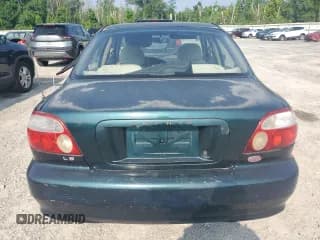 ✅ 2001 Kia Sephia • VIN: KNAFB121315012631 • Lot: 62910125. Listed on Copart with 132,002 mi. Free auction sales archive from the USA and detailed vehicle history report at DreamBid. Image 6.