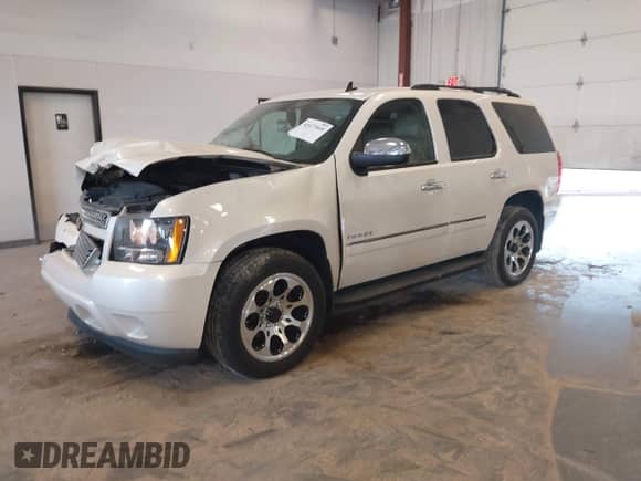 2011 Chevrolet Tahoe LTZ with VIN 1GNSKCE03BR311926, listed as a IAAI auction lot 42677010 with 150,432 mi miles and . Bid and sale history available at DreamBid. Image 2.