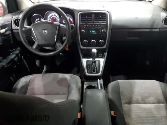 ✅ 2010 Dodge Caliber Mainstreet • VIN: 1B3CB3HA0AD638864 • Лот: 85395355. Опубликован ранее на Copart с пробегом 103 604 миль. Бесплатный доступ к архиву аукционных продаж из США и подробный отчёт об истории автомобиля на DreamBid. Изображение 8.