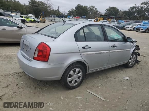 ✅ 2006 Hyundai Accent GLS • VIN: KMHCN46C06U047601 • Лот: 41873365. Опубликован ранее на Copart с пробегом 163 812 миль. Бесплатный доступ к архиву аукционных продаж из США и подробный отчёт об истории автомобиля на DreamBid. Изображение 3.
