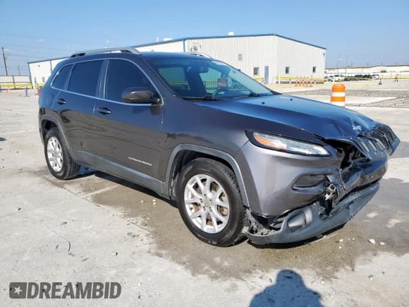 ✅ 2015 Jeep Cherokee Latitude • VIN: 1C4PJLCS5FW516841 • Lot: 84189215. Listed on Copart with 164,493 mi. Free auction sales archive from the USA and detailed vehicle history report at DreamBid. Image 4.
