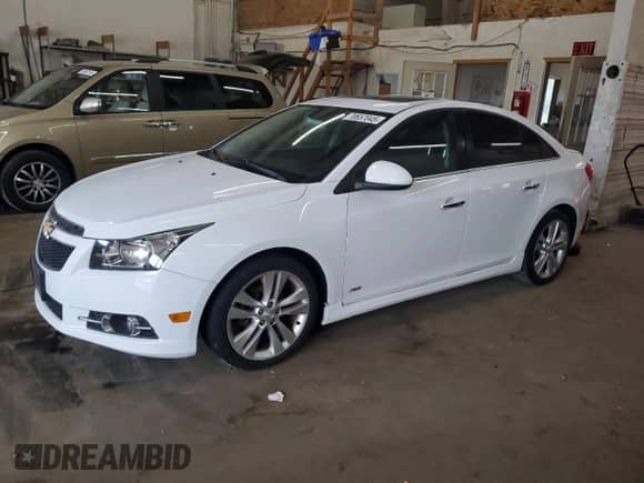2014 Chevrolet Cruze LTZ with VIN 1G1PG5SB4E7354584, listed as a Copart auction lot 70657045 with 118,174 mi miles and Salvage title. Bid and sale history available at DreamBid. Image 1.