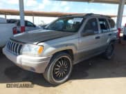 ✅ 2001 Jeep Grand Cherokee Laredo • VIN: 1J4GX48S21C648442 • Lot: 42023940. Listed on IAAI with 202,630 mi. Free auction sales archive from the USA and detailed vehicle history report at DreamBid. Image 2.