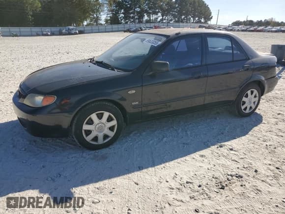 ✅ 2003 Mazda Protege DX • VIN: JM1BJ225730164909 • Lot: 89633055. Wystawiony na Copart z przebiegiem 155 327 mil. Bezpłatny archiwum sprzedaży aukcyjnych z USA i szczegółowy raport historii pojazdu na DreamBid. Zdjęcie 1.