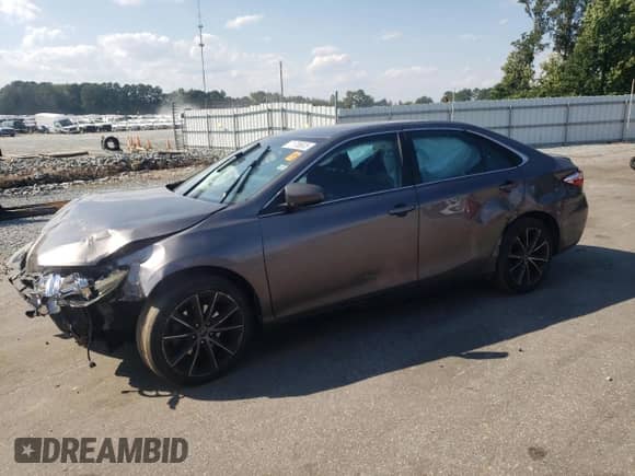 2015 Toyota Camry LE with VIN 4T1BF1FK2FU879326, listed as a Copart auction lot 71708635 with 128,243 mi miles and Salvage title. Bid and sale history available at DreamBid. Image 1.