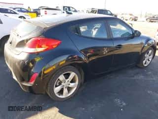 2012 Hyundai Veloster w/Red Int with VIN KMHTC6AD2CU029761, listed as a IAAI auction lot 43603146 with 64,357 mi miles and . Bid and sale history available at DreamBid. Image 4.