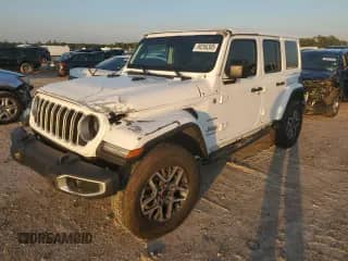 2024 Jeep Wrangler Sahara with VIN 1C4PJXEG1RW262694, listed as a Copart auction lot 90266305 with 12,760 mi miles and Salvage title. Bid and sale history available at DreamBid. Image 1.