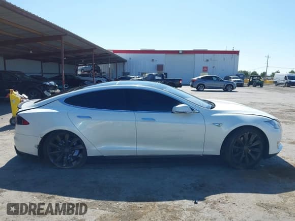 ✅ 2013 Tesla Model S Performance • VIN: 5YJSA1DP5DFP16614 • Lot: 42605848. Listed on IAAI with 123,914 mi. Free auction sales archive from the USA and detailed vehicle history report at DreamBid. Image 14.