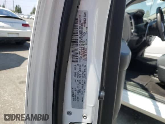 2017 Ram 1500 Tradesman z VIN 3C6JR6AG1HG791498, wystawiony jako Copart lot #60173345 z przebiegiem 89 814 mil mil oraz Szkoda całkowita • Salvage title. Historia ofert i sprzedaży dostępna na DreamBid. Obrazek 13.