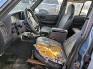 ✅ 1999 Jeep Cherokee SE • VIN: 1J4FF28S5XL646812 • Lot: 87951115. Listed on Copart with 230,161 mi. Free auction sales archive from the USA and detailed vehicle history report at DreamBid. Image 7.