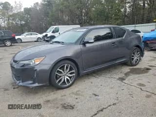 ✅ 2016 Scion tC • VIN: JTKJF5C73GJ021737 • Lot: 93996105. Wystawiony na Copart z przebiegiem 126 125 mil. Bezpłatny archiwum sprzedaży aukcyjnych z USA i szczegółowy raport historii pojazdu na DreamBid. Zdjęcie 1.