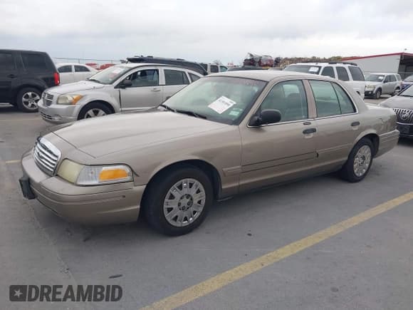 ✅ 2005 Ford Crown Victoria Standard • VIN: 2FAFP73W65X114422 • Lot: 41301890. Listed on IAAI with 209,199 mi. Free auction sales archive from the USA and detailed vehicle history report at DreamBid. Image 2.