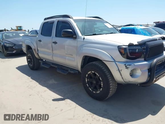 ✅ 2010 Toyota Tacoma PreRunner • VIN: 3TMJU4GN3AM098103 • Lot: 41981209. Listed on IAAI with 218,329 mi. Free auction sales archive from the USA and detailed vehicle history report at DreamBid. Image 1.