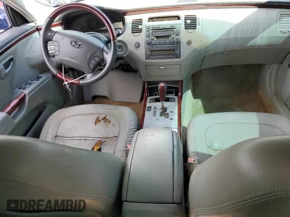 2006 Hyundai Azera SE с VIN KMHFC46F36A129241, выставлен на аукционе Copart как лот 51295615 с пробегом Не указан миль и Списание • Salvage title. История ставок и продаж доступна на DreamBid. Изображение 8.