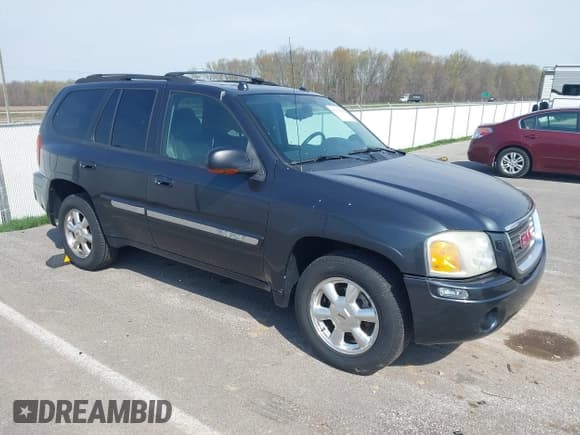 ✅ 2005 GMC Envoy SLE • VIN: 1GKDT13S052299632 • Lot: 41966628. Listed on IAAI with 199,312 mi. Free auction sales archive from the USA and detailed vehicle history report at DreamBid. Image 1.