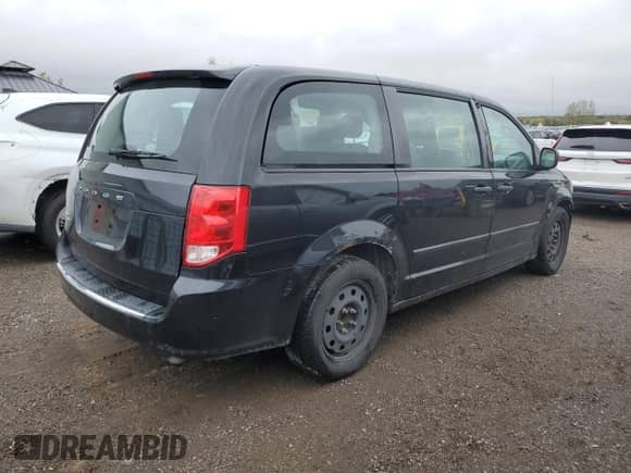 2014 Dodge Grand Caravan SE with VIN 2C4RDGBG9ER476016, listed as a Copart auction lot 85492545 with 243,479 mi miles and Salvage title. Bid and sale history available at DreamBid. Image 3.