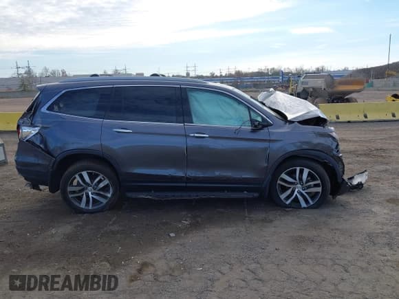 ✅ 2017 Honda Pilot Touring • VIN: 5FNYF5H9XHB033165 • Лот: 43716302. Опубликован ранее на IAAI с пробегом 41 149 миль. Бесплатный доступ к архиву аукционных продаж из США и подробный отчёт об истории автомобиля на DreamBid. Изображение 13.