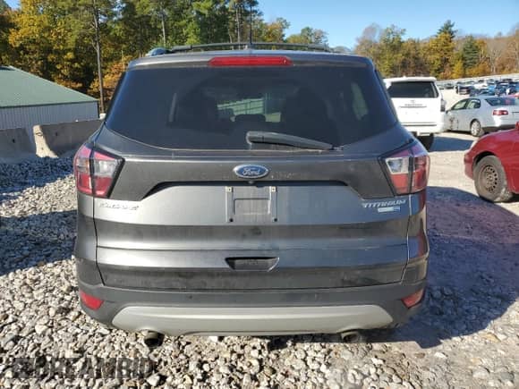 2017 Ford Escape Titanium с VIN 1FMCU9J98HUC40710, выставлен на аукционе Copart как лот 82381355 с пробегом 124 333 миль миль и Списание • Salvage title. История ставок и продаж доступна на DreamBid. Изображение 6.