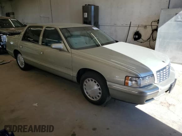 ✅ 1997 Cadillac DeVille • VIN: 1G6KD54Y6VU271755 • Lot: 73168894. Listed on Copart with 32,512 mi. Free auction sales archive from the USA and detailed vehicle history report at DreamBid. Image 4.