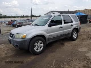 ✅ 2005 Ford Escape Hybrid • VIN: 1FMCU96H55KC74059 • Lot: 57065685. Wystawiony na Copart z przebiegiem 154 807 mil. Bezpłatny archiwum sprzedaży aukcyjnych z USA i szczegółowy raport historii pojazdu na DreamBid. Zdjęcie 1.