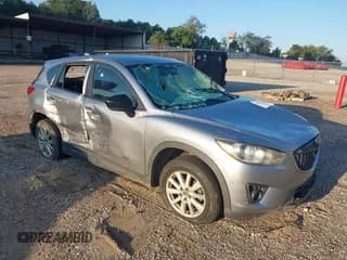 ✅ 2013 Mazda CX-5 Touring • VIN: JM3KE2CE1D0103888 • Lot: 43298744. Listed on IAAI with 305,966 mi. Free auction sales archive from the USA and detailed vehicle history report at DreamBid. Image 1.
