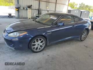 2008 Hyundai Tiburon GT z VIN KMHHN66FX8U280481, wystawiony jako Copart lot #52960165 z przebiegiem 133 063 mil mil oraz Nie do naprawy • Non repairable. Historia ofert i sprzedaży dostępna na DreamBid. Obrazek 1.