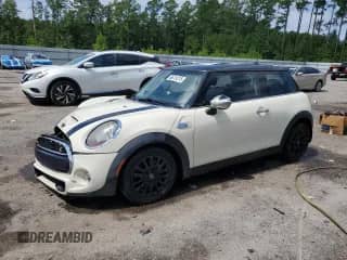 2014 MINI Hardtop S with VIN WMWXM7C59ET987347, listed as a Copart auction lot 66751215 with 142,659 mi miles and Salvage title. Bid and sale history available at DreamBid. Image 1.