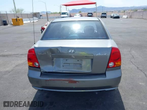 2003 Hyundai Accent GL with VIN KMHCG45C73U471607, listed as a IAAI auction lot 41956551 with 222,305 mi miles and . Bid and sale history available at DreamBid. Image 14.