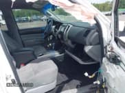 ✅ 2014 Toyota Tacoma PreRunner • VIN: 3TMJU4GN5EM161224 • Lot: 43179702. Listed on IAAI with 148,222 mi. Free auction sales archive from the USA and detailed vehicle history report at DreamBid. Image 5.