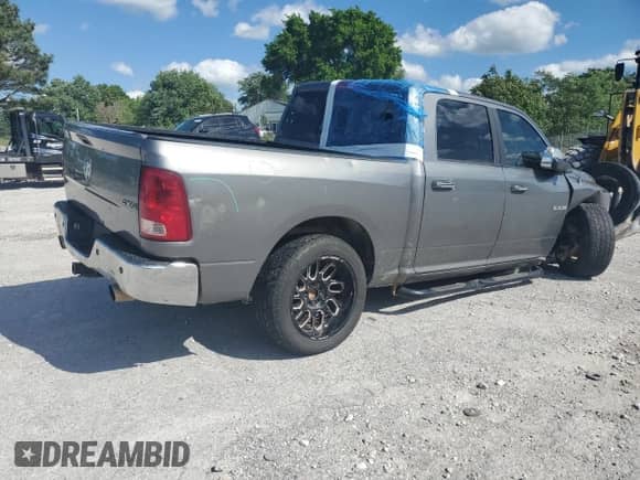 2009 Dodge 1500 SLT with VIN 1D3HV13T69S746672, listed as a Copart auction lot 64733015 with 226,944 mi miles and Salvage title. Bid and sale history available at DreamBid. Image 3.