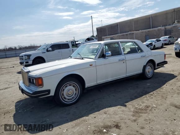 ✅ 1985 Rolls-Royce Silver Spirit • VIN: SCAZS42A6FCX12526 • Lot: 51090895. Listed on Copart with 51,429 mi. Free auction sales archive from the USA and detailed vehicle history report at DreamBid. Image 1.