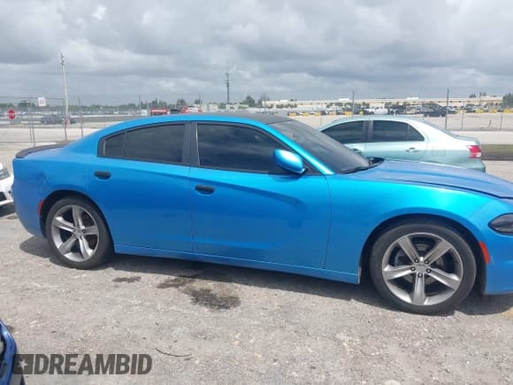 ✅ 2015 Dodge Charger SXT • VIN: 2C3CDXHG3FH827754 • Lot: 42012425. Listed on IAAI with 119,057 mi. Free auction sales archive from the USA and detailed vehicle history report at DreamBid. Image 13.