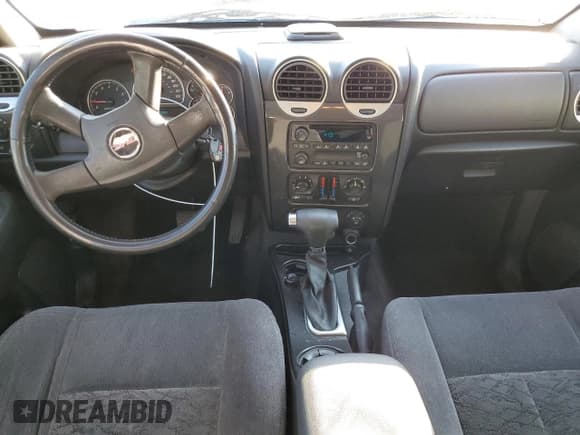 ✅ 2006 GMC Envoy SLE • VIN: 1GKES16SX66173565 • Лот: 43982355. Опубликован ранее на Copart с пробегом 297 894 миль. Бесплатный доступ к архиву аукционных продаж из США и подробный отчёт об истории автомобиля на DreamBid. Изображение 8.