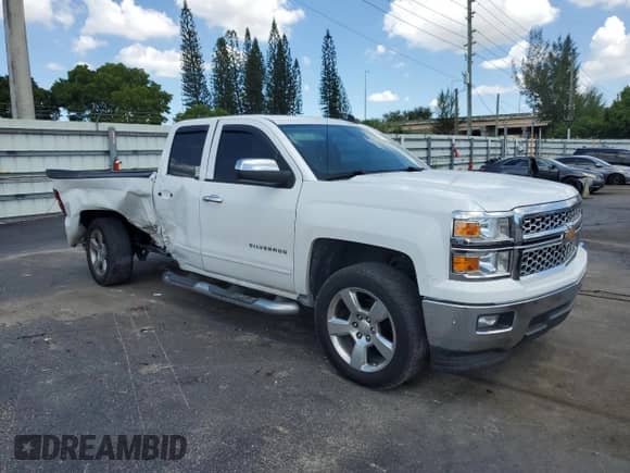 2015 Chevrolet Silverado 1500 LT with VIN 1GCRCREC8FZ362782, listed as a Copart auction lot 69407325 with 34,390 mi miles and Salvage title. Bid and sale history available at DreamBid. Image 4.