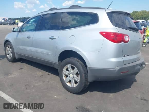 2011 Chevrolet Traverse 1LT z VIN 1GNKRGED0BJ389472, wystawiony jako IAAI lot #43265950 z przebiegiem 203 318 mil mil oraz . Historia ofert i sprzedaży dostępna na DreamBid. Obrazek 3.