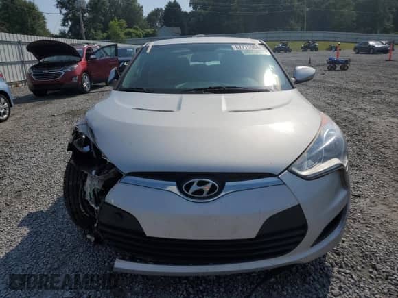 2014 Hyundai Veloster z VIN KMHTC6AD1EU183378, wystawiony jako Copart lot #67775904 z przebiegiem 121 477 mil mil oraz Szkoda całkowita • Salvage title. Historia ofert i sprzedaży dostępna na DreamBid. Obrazek 5.