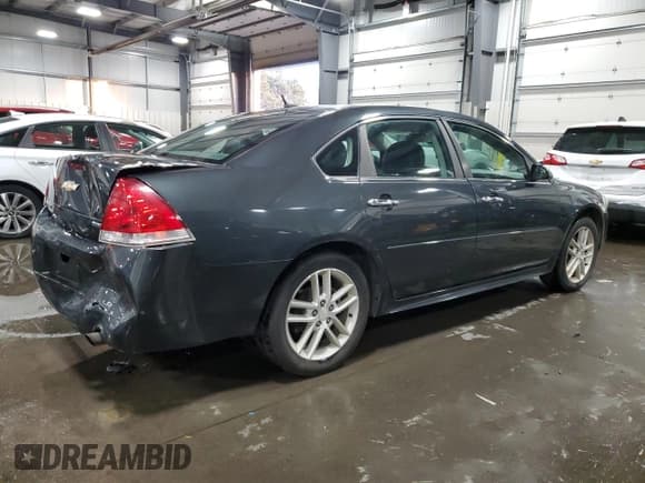 ✅ 2014 Chevrolet Impala LTZ • VIN: 2G1WC5E36E1156579 • Lot: 91980555. Listed on Copart with 149,625 mi. Free auction sales archive from the USA and detailed vehicle history report at DreamBid. Image 3.