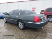 ✅ 2003 Lincoln Town Car Cartier • VIN: 1LNHM83W73Y651035 • Lot: 43579973. Listed on IAAI with 244,866 mi. Free auction sales archive from the USA and detailed vehicle history report at DreamBid. Image 3.