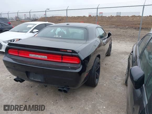 2014 Dodge Challenger R/T 100th Anniversary Appearance with VIN 2C3CDYBT6EH242063, listed as a IAAI auction lot 41490675 with 143,802 mi miles and . Bid and sale history available at DreamBid. Image 4.