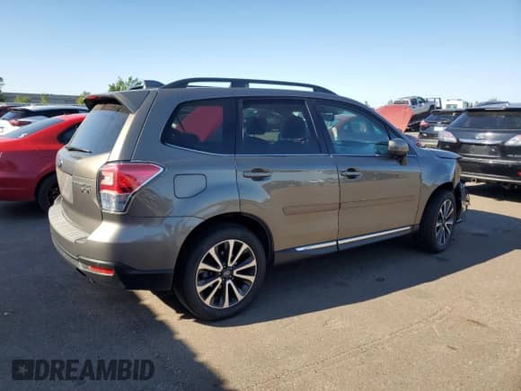 2017 Subaru Forester Touring с VIN JF2SJGWC4HH585860, выставлен на аукционе Copart как лот 85157815 с пробегом 89 784 миль миль и Списание • Salvage title. История ставок и продаж доступна на DreamBid. Изображение 3.