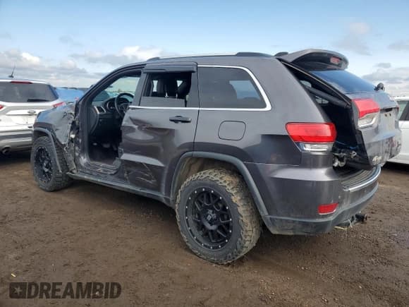 ✅ 2017 Jeep Grand Cherokee • VIN: 1C4HJFBG4HC728433 • Lot: 59215585. Listed on Copart with 143,085 mi. Free auction sales archive from the USA and detailed vehicle history report at DreamBid. Image 2.