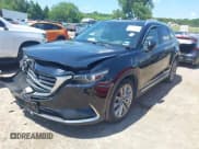 ✅ 2016 Mazda CX-9 Grand Touring • VIN: JM3TCADY3G0109113 • Lot: 42673583. Wystawiony na IAAI z przebiegiem 122 463 mil. Bezpłatny archiwum sprzedaży aukcyjnych z USA i szczegółowy raport historii pojazdu na DreamBid. Zdjęcie 2.