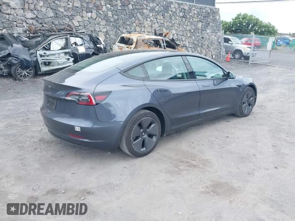 ✅ 2023 Tesla Model 3 • VIN: 5YJ3E1EA5PF643087 • Lot: 43528325. Listed on IAAI with 38,613 mi. Free auction sales archive from the USA and detailed vehicle history report at DreamBid. Image 4.
