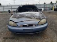 ✅ 1999 Mercury Sable LS • VIN: 1MEFM53S4XG649132 • Лот: 70168934. Опубликован ранее на Copart с пробегом Не указан. Бесплатный доступ к архиву аукционных продаж из США и подробный отчёт об истории автомобиля на DreamBid. Изображение 5.