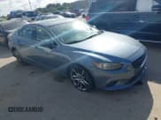 ✅ 2014 Mazda 6 i Grand Touring • VIN: JM1GJ1W62E1126147 • Lot: 43697289. Listed on IAAI with 140,014 mi. Free auction sales archive from the USA and detailed vehicle history report at DreamBid. Image 1.