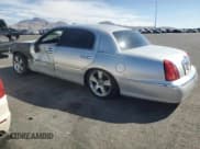 ✅ 2000 Lincoln Town Car Executive • VIN: 1LNHM81W9YY908643 • Lot: 68047715. Listed on Copart with 129,499 mi. Free auction sales archive from the USA and detailed vehicle history report at DreamBid. Image 2.