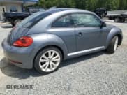 ✅ 2014 Volkswagen Beetle 1.8T • VIN: 3VWJ17AT1EM652372 • Lot: 61542145. Wystawiony na Copart z przebiegiem 71 158 mil. Bezpłatny archiwum sprzedaży aukcyjnych z USA i szczegółowy raport historii pojazdu na DreamBid. Zdjęcie 3.